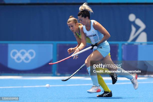 Agustina Albertarrio of Team Argentina and Karri Somerville of Team Australia compete for the ball during the Women's Preliminary Pool B match...