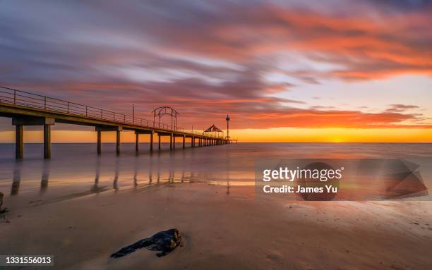 brighton jetty sunset - adelaide stock-fotos und bilder