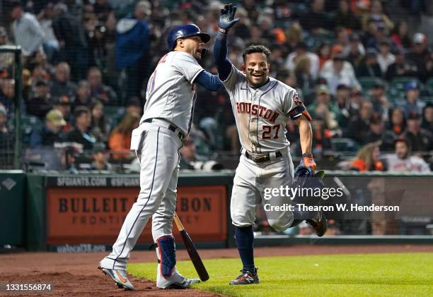 Jose Altuve and Yuli Gurriel of the Houston Astros celebrates after Altuve hit a solo home run against the San Francisco Giants in the top of the...
