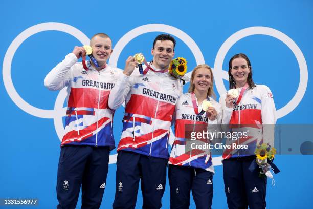 Gold medalists Adam Peaty, James Guy, Anna Hopkin and Kathleen Dawson of Team Great Britain poses during the medal ceremony for the Mixed 4 x 100m...