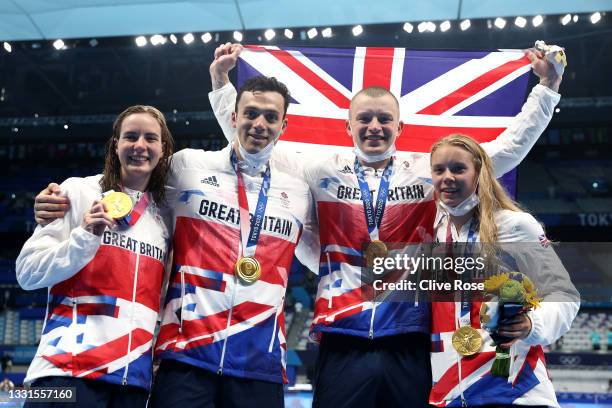 Gold medalists Kathleen Dawson, Adam Peaty, James Guy, Anna Hopkin and of Team Great Britain poses after the medal ceremony for the Mixed 4 x 100m...
