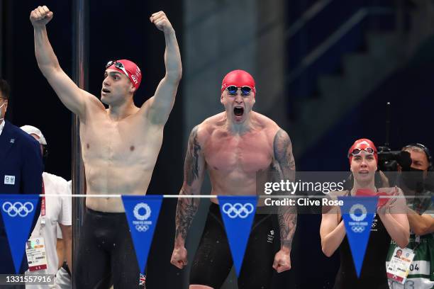 James Guy, Adam Peaty and Kathleen Dawson of Team Great Britain react during the Mixed 4 x 100m Medley Relay Final at Tokyo Aquatics Centre on July...