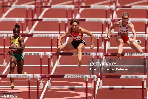 Ayako Kimura of Team Japan competes in round one of the Women's 100m hurdles heats on day eight of the Tokyo 2020 Olympic Games at Olympic Stadium on...