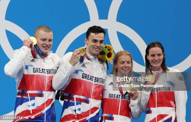 Gold medalists Adam Peaty, James Guy, Anna Hopkin and Kathleen Dawson of Team Great Britain pose during the medal ceremony for the Mixed 4 x 100m...