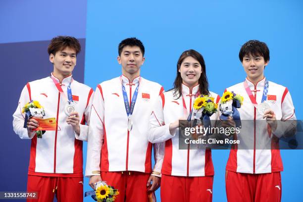 Silver medalists Jiayu Xu, Zibei Yan, Yufei Zhang and Junxuan Yang of Team China pose on the podium during the medal ceremony for the Mixed 4 x 100m...