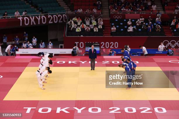 Team Japan lines up to face Team Germany during the Mixed Team Quarter Final on day eight of the Tokyo 2020 Olympic Games at Nippon Budokan on July...