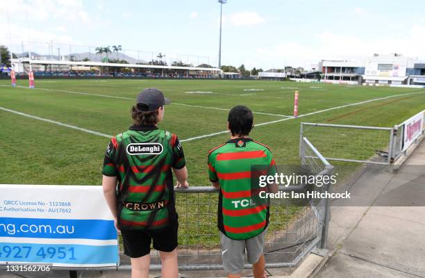 Rabbitohs fans are seen looking out onto the field of play after the game was cancelled at the round 20 NRL match between the St George Illawarra...