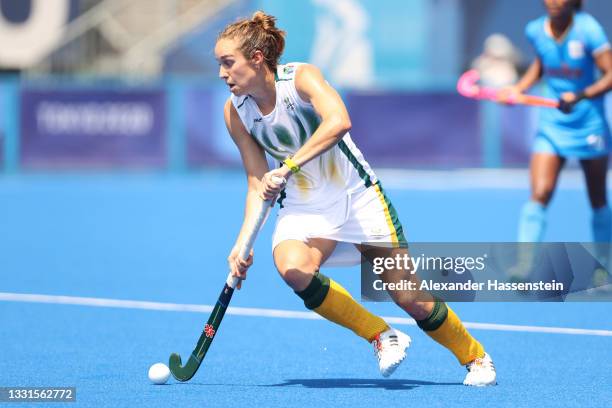 Kristen Paton of Team South Africa runs upfield with the ball against during the Women's Preliminary Pool A match between India and South Africa on...