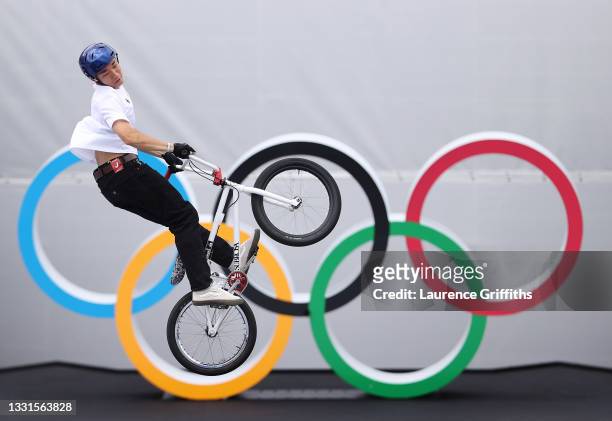 Rim Nakamura of Team Japan in action in front of the Olympic rings logo during the Men's BMX Freestyle seeding event on day eight on day eight of the...