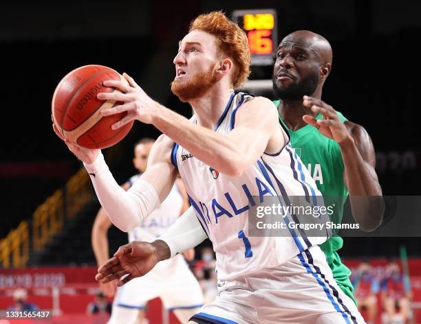 Niccolo Mannion of Team Italy drives to the basket against Obi Emegano of Team Nigeria during the first half of a Men's Basketball Preliminary Round...