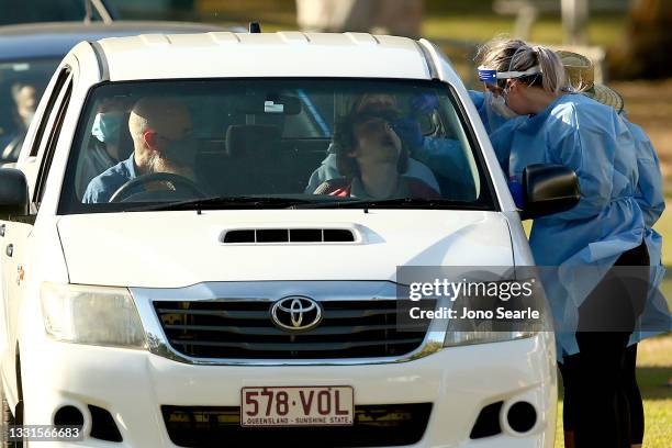 Residents are tested for COVID-19 at a pop up testing clinic at Indooroopilly State High School, on July 31, 2021 in Brisbane, Australia. Eleven...