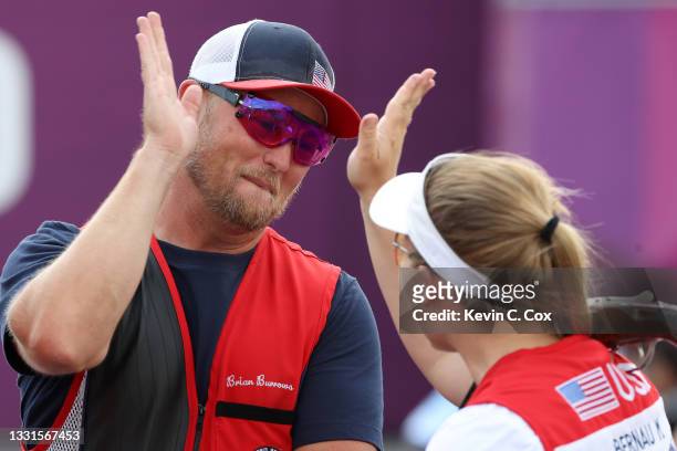 Bronze Medalists Brian Burrows and Madelynn Ann Bernau of Team United States celebrate following the Trap Mixed Team Bronze Medal Match on day eight...