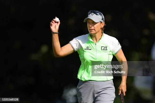 Annika Sorenstam of Sweden acknowledges the gallery after sinking a putt on the 15th hole during the second round of the U.S. Senior Women"u2019s...