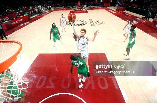 Niccolo Mannion of Team Italy goes up for a shot against Ike Nwamu of Team Nigeria during the second half of a Men's Basketball Preliminary Round...