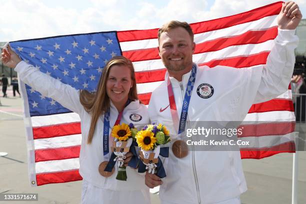 Bronze Medalists Madelynn Ann Bernau and Brian Burrows of Team United States pose following the Trap Mixed Team Bronze Medal Match on day eight of...