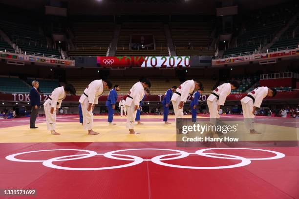 Team Japan head out to face the Russian Olympic Committee during the Mixed Team Semifinal of Table A on day eight of the Tokyo 2020 Olympic Games at...