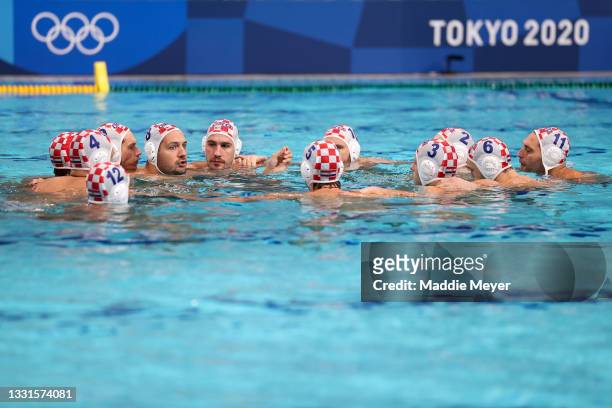 Team Croatia form a huddle during the Men's Preliminary Round Group B match between Croatia and Serbia on day eight of the Tokyo 2020 Olympic Games...
