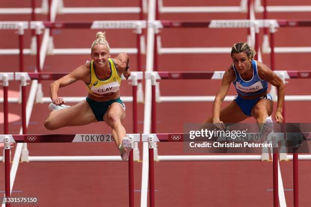 Liz Clay of Team Australia and Luminosa Bogliolo of Team Italy compete in the Women's 100m hurdles heats on day eight of the Tokyo 2020 Olympic Games...