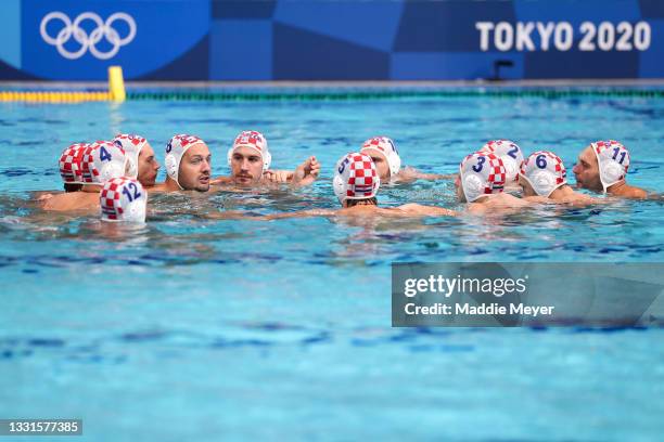 Team Croatia form a huddle during the Men's Preliminary Round Group B match between Croatia and Serbia on day eight of the Tokyo 2020 Olympic Games...