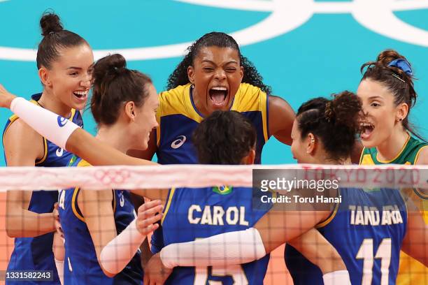 Fernanda Rodrigues of Team Brazil celebrates with teammates after scoring a point against Team Serbia during the Women's Preliminary - Pool A...