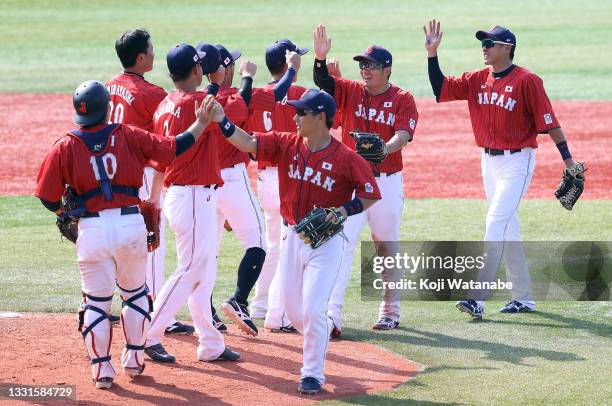 Yuki Yanagita of Team Japan and his Team Japan teammates celebrate after their 7-4 win against Team Mexico during the baseball opening round Group A...