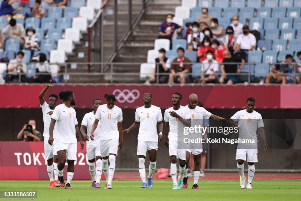Eric Bailly of Team Ivory Coast celebrates with teammates after scoring their side's first goal during the Men's Quarter Final match between Spain...