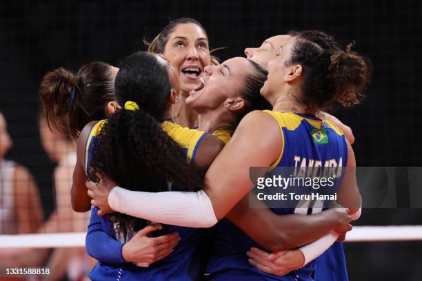 Gabriela Braga Guimaraes of Team Brazil celebrates with teammates against Team Serbia during the Women's Preliminary - Pool A volleyball on day eight...