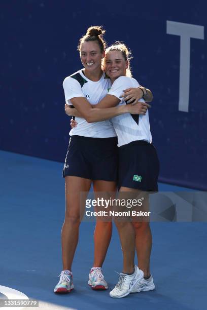 Luisa Stefani of Team Brazil and Laura Pigossi of Team Brazil celebrate victory after their Women's Doubles Bronze Medal match against Veronika...