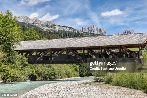 wooden bridge in soraga di fassa - soraga stock pictures, royalty-free photos & images