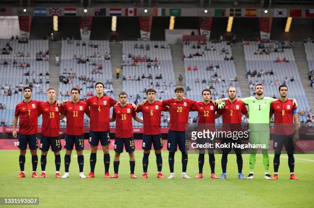 Players of Team Spain stand for the national anthem prior to the Men's Quarter Final match between Spain and Cote d'Ivoire on day eight of the Tokyo...