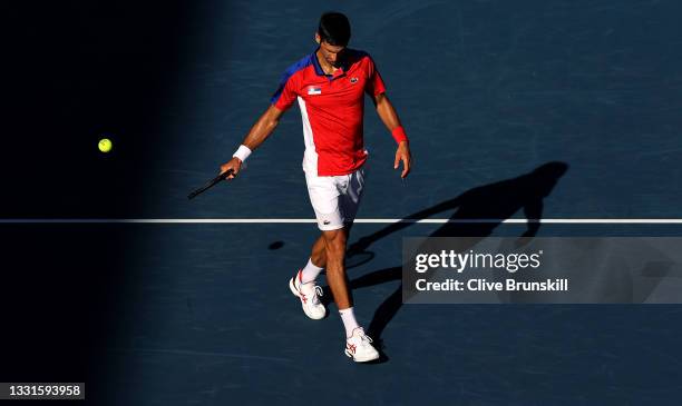 Novak Djokovic of Team Serbia completes a service game during his Men's Singles Bronze Medal match against Pablo Carreno Busta of Team Spain on day...