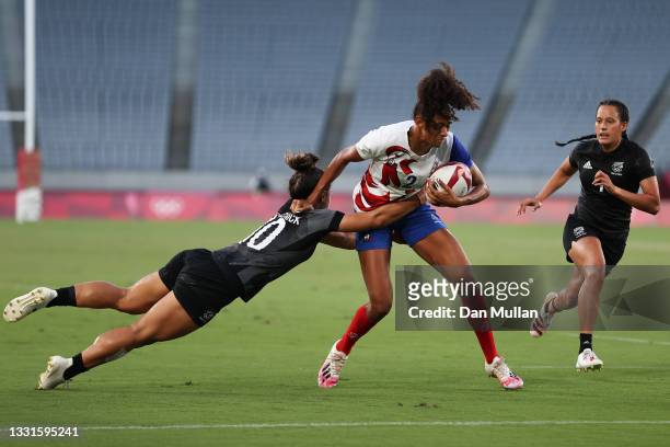 Anne-Cecile Ciofani of Team France beats the tackle of Theresa Fitzpatrick of Team New Zealand to score a try in the Women’s Gold Medal match between...
