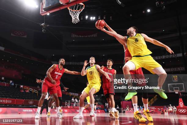 Matthew Dellavedova of Team Australia drives to the basket against Germany during the second half of a Men's Basketball Preliminary Round Group B...