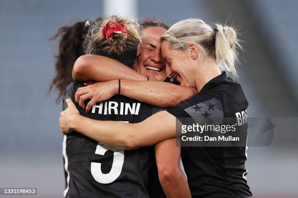 Sarah Hirini, Portia Woodman and Kelly Brazier of Team New Zealand celebrate after defeating Team France in the Women’s Gold Medal match between Team...