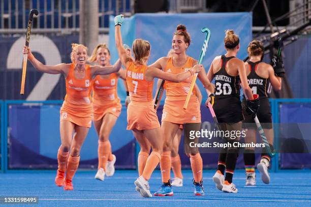 Frederique Matla of Team Netherlands celebrates with teammate Xan Gerdien de Waard after scoring their team's first goal during the Women's...