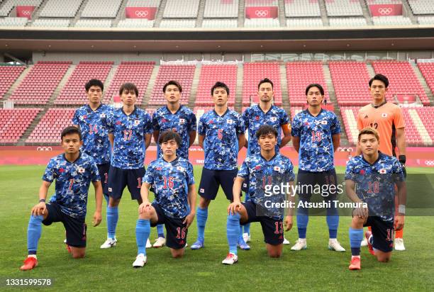 Players of Team Japan pose for a team photograph prior to the Men's Quarter Final match between Japan and New Zealand on day eight of the Tokyo 2020...
