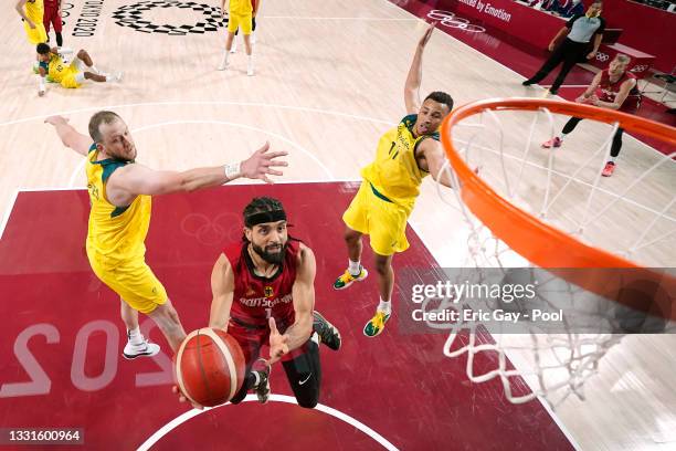 Joshiko Saibou of Team Germany drives to the basket against Joe Ingles and Dante Exum of Team Australia during the second half of a Men's Basketball...