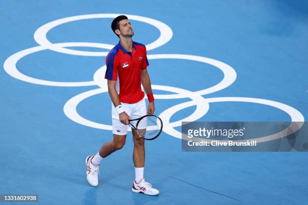 Novak Djokovic of Team Serbia reacts after a point during his Men's Singles Bronze Medal match against Pablo Carreno Busta of Team Spain on day eight...