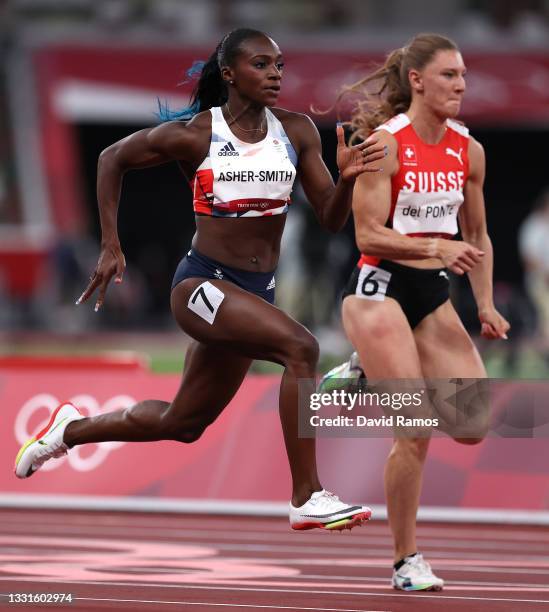 Dina Asher-Smith of Team Great Britain and Ajla Del Ponte of Team Switzerland compete in the Women's 100m Semi-Final on day eight of the Tokyo 2020...