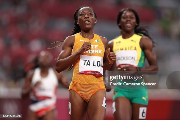 Marie-Josee Ta Lou of Team Ivory Coast reacts after completing her Women's 100m Semi-Final on day eight of the Tokyo 2020 Olympic Games at Olympic...