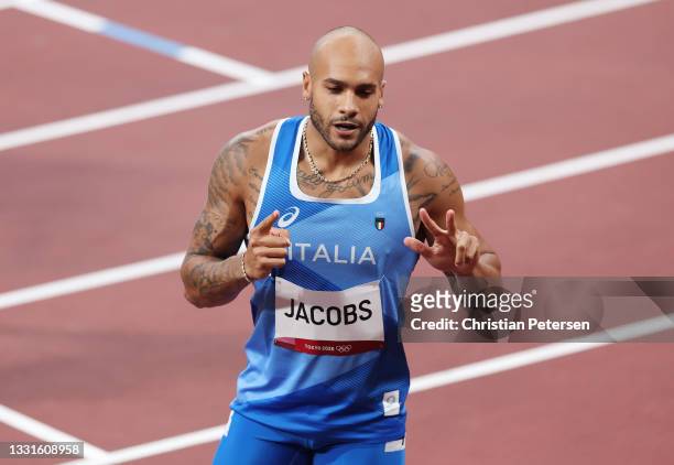 Lamont Marcell Jacobs of Team Italy celebrates after competing in the Men's 100m Round 1 heats on day eight of the Tokyo 2020 Olympic Games at...