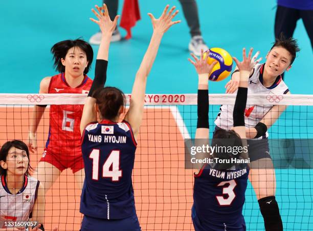 Mayu Ishikawa of Team Japan competes against Hyo Jin Yang and Hye Seon Yeum of Team South Korea during the Women's Preliminary - Pool A volleyball on...
