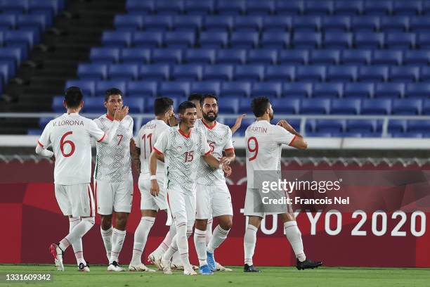 Henry Martin of Team Mexico celebrates with teammates after scoring their side's first goal during the Men's Quarter Final match between Republic Of...