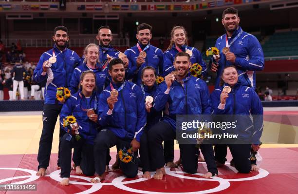 Bronze Medalists Team Israel pose with their bronze medals for Judo the Mixed Team Final on day eight of the Tokyo 2020 Olympic Games at Nippon...