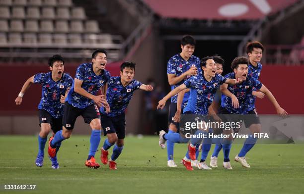 Players of Team Japan celebrate following their team's victory in the penalty shoot out after the Men's Quarter Final match between Japan and New...