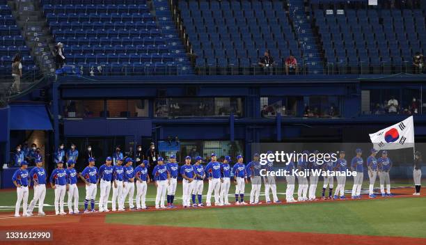 Team South Korea line up for the national anthems during the baseball opening round Group B game between Team South Korea and Team United States on...