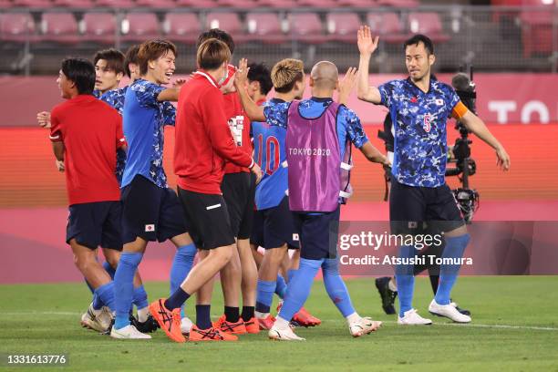 Players of Team Japan celebrate following victory in the Men's Quarter Final match between Japan and New Zealand on day eight of the Tokyo 2020...