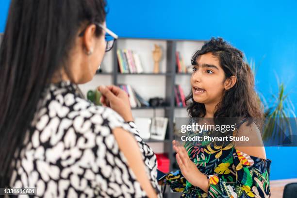 mother and her teenage daughter arguing at home - teen fight stock pictures, royalty-free photos & images