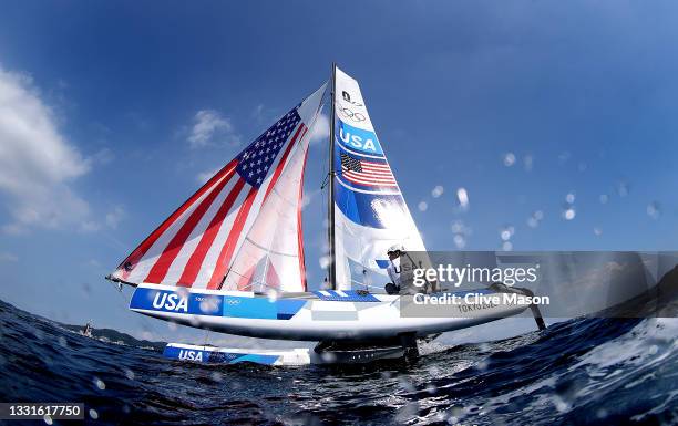 Riley Gibbs and Anna Weis of Team United States compete in the Nacra 17 Foiling class on day eight of the Tokyo 2020 Olympic Games at Enoshima Yacht...