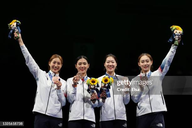 Bronze medalists Team Republic of Korea pose on the podium during the medal ceremony for the Women's Sabre Team Fencing on day eight of the Tokyo...